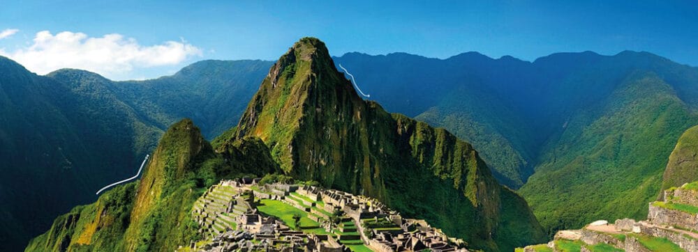 Ancient Inca city Machu Picchu surrounded by lush green mountains in Peru.