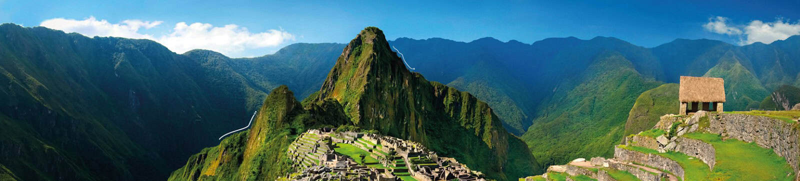 Ancient Inca city Machu Picchu surrounded by lush green mountains in Peru.
