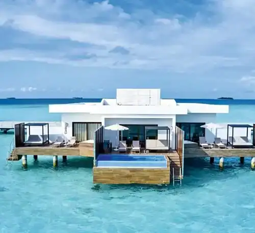 Luxury overwater villa with private pools and ocean views at El Kaminante.