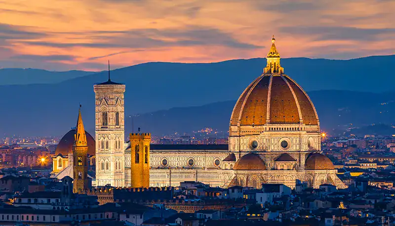 Florence Cathedral with sunset sky and cityscape in Italy.