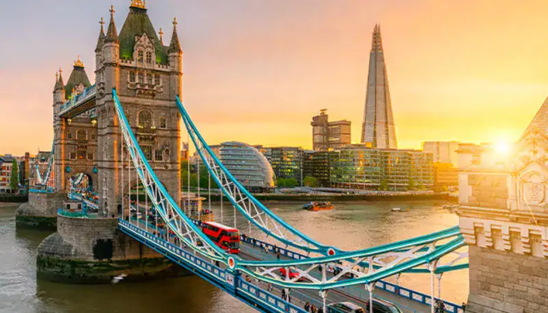 London Tower Bridge at sunset with the Shard in the background, showcasing iconic architecture and v.