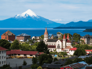 Scenic view of a town with a church and Mount Cook in the background, New Zealand.