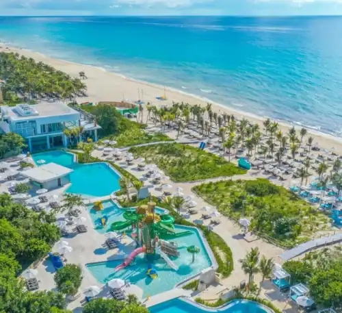 Relaxing beach resort with pools and palm trees on the Uruguayan coast.